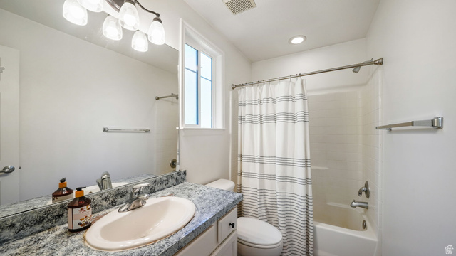 1285 Alpine Way Provo, UT 84606 - Photo 22 of 25 Granite-finish countertop with an undermount sink, brushed nickel faucet, and a large mirror