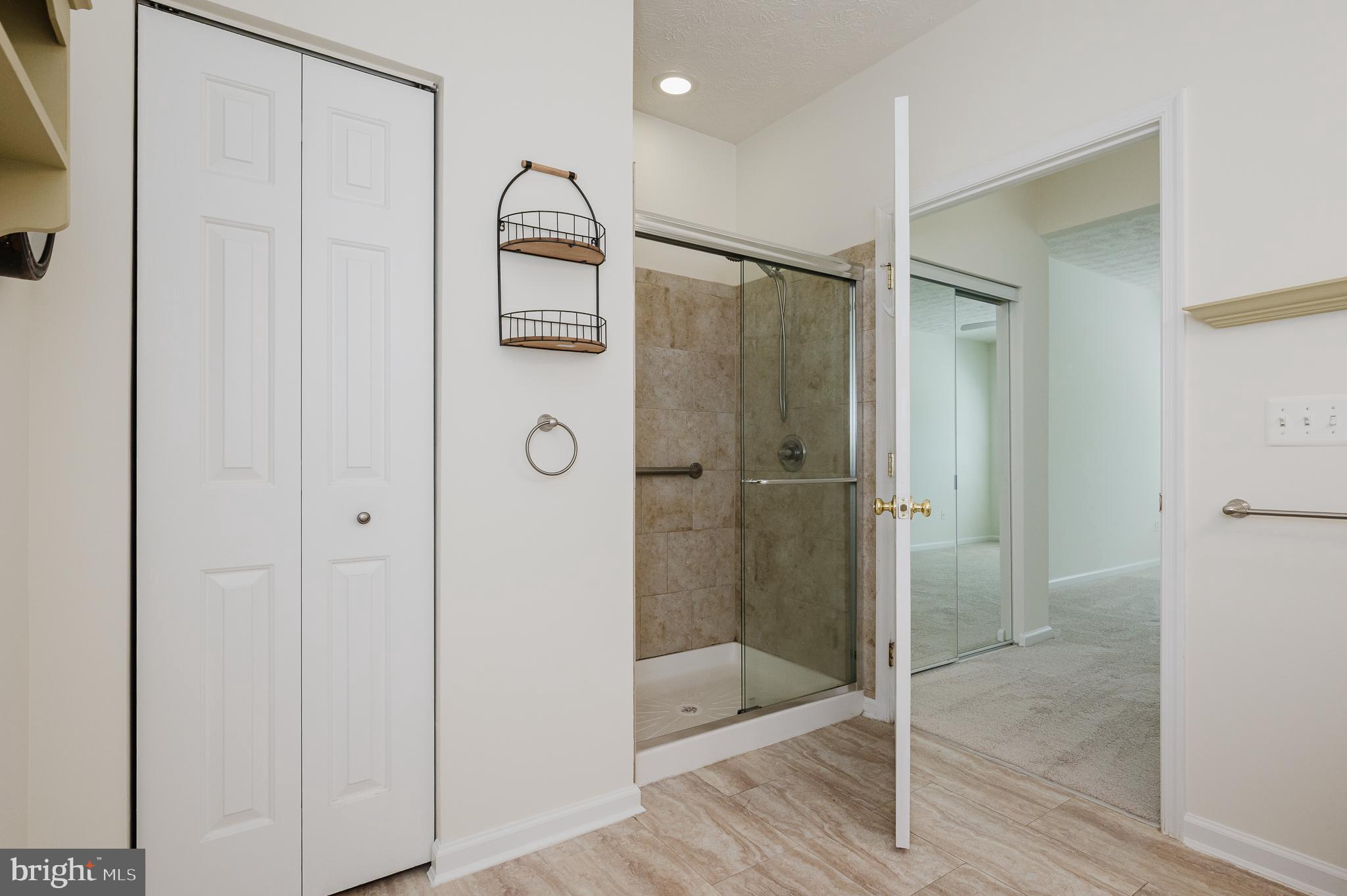 4928 Brightleaf Court, Unit 4928 Rosedale, MD 21237 - Photo 18 of 40 Stall shower and linen closet