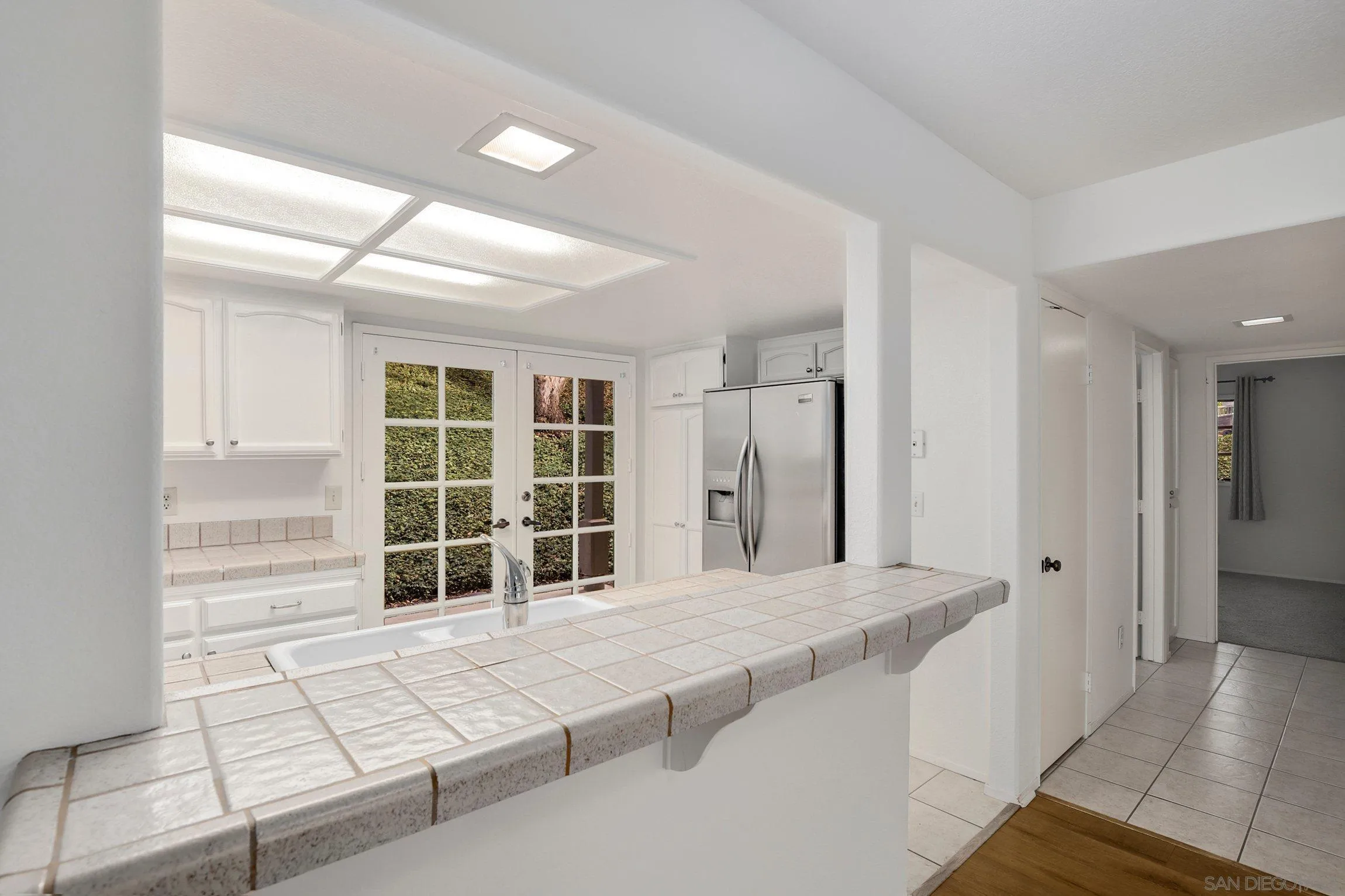 381 Playa Blanca Encinitas, CA 92024 - Photo 15 of 41 a large bedroom with a bed and a window