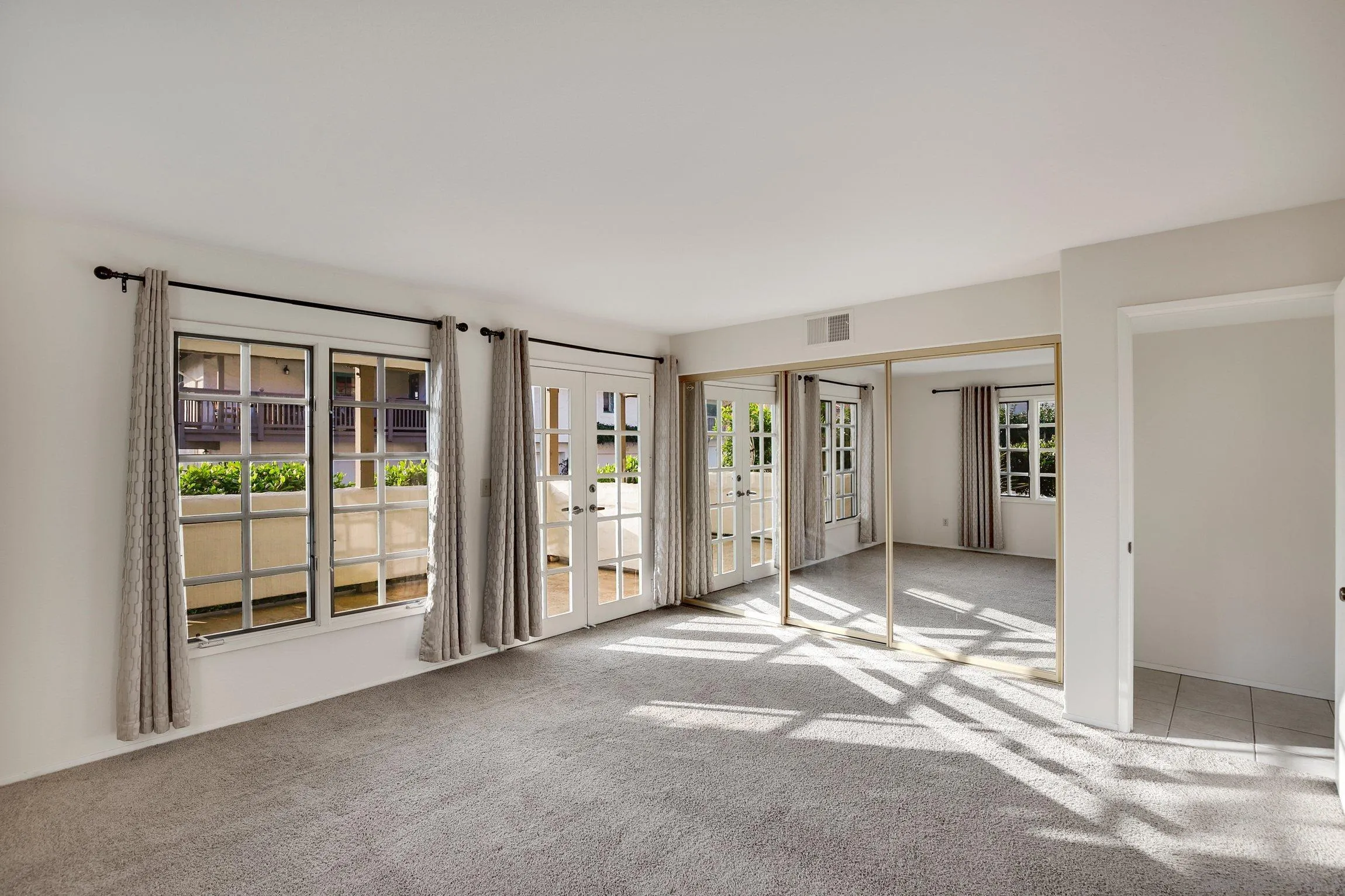 381 Playa Blanca Encinitas, CA 92024 - Photo 17 of 41 a view of a big room with windows and entryway