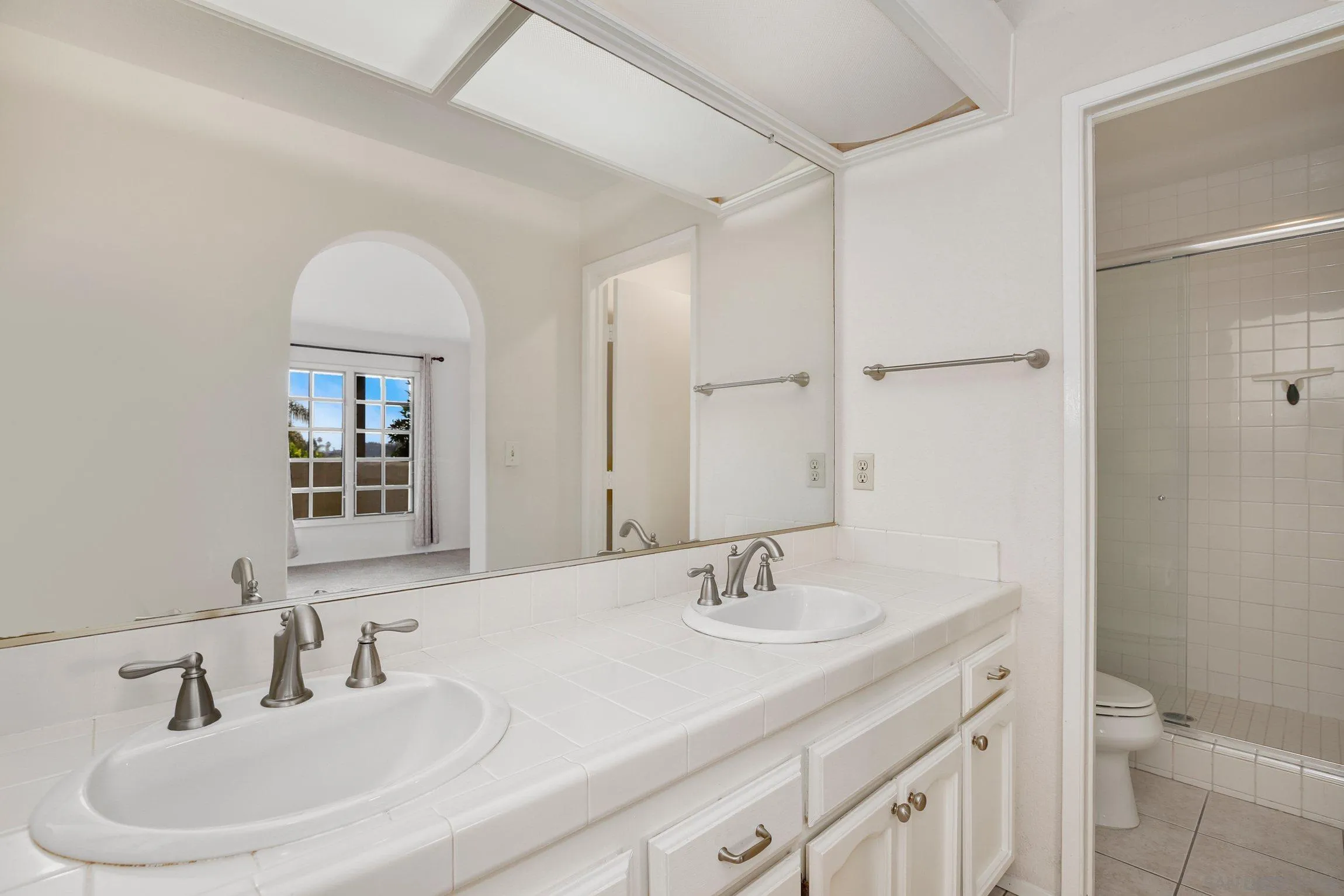 381 Playa Blanca Encinitas, CA 92024 - Photo 18 of 41 a bathroom with 2 sink and a mirror