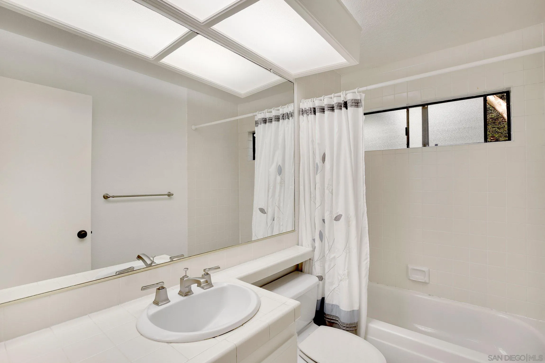 381 Playa Blanca Encinitas, CA 92024 - Photo 23 of 41 a bathroom with a sink toilet and shower