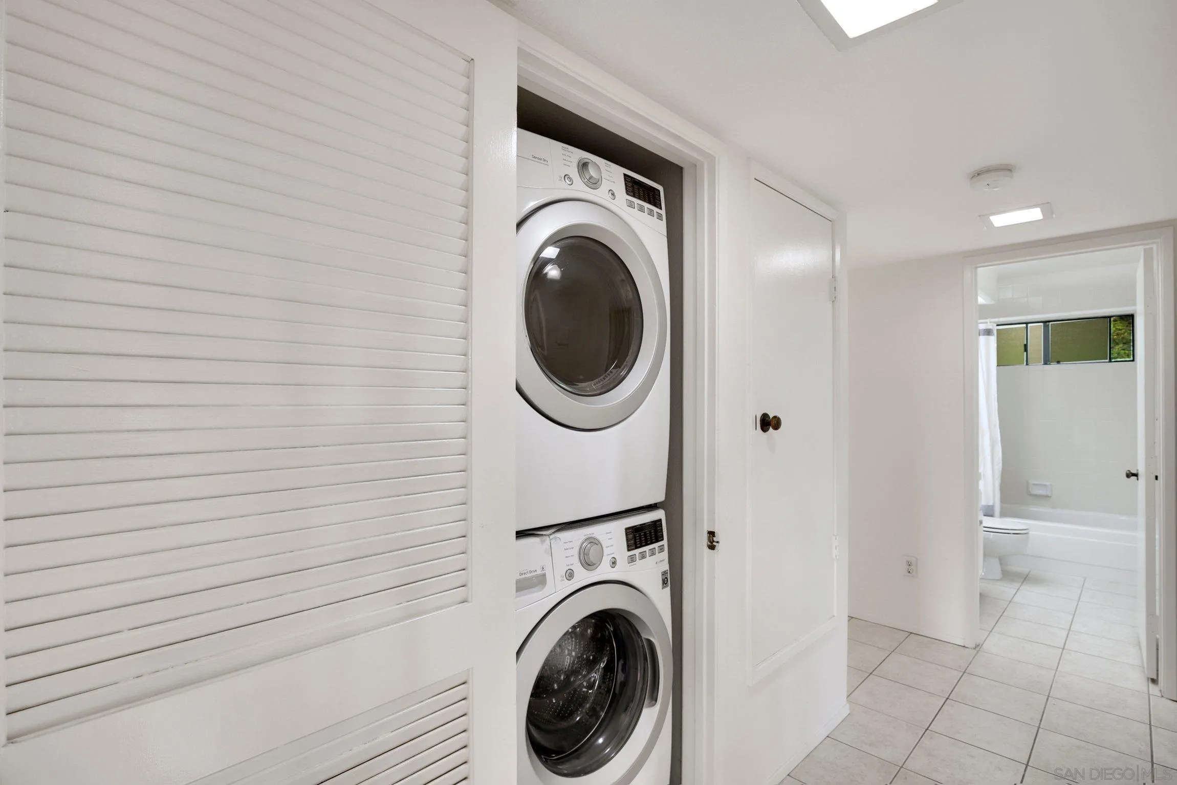 381 Playa Blanca Encinitas, CA 92024 - Photo 24 of 41 a utility room with dryer and washer