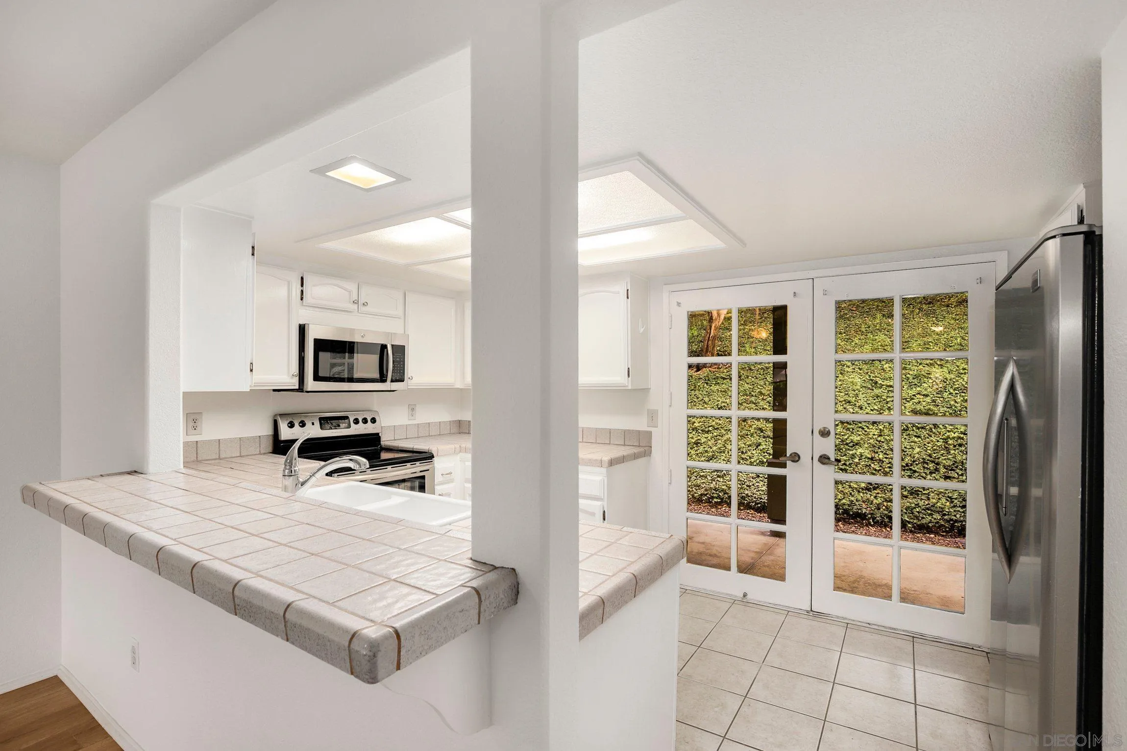 381 Playa Blanca Encinitas, CA 92024 - Photo 10 of 41 a view of kitchen with sink and refrigerator