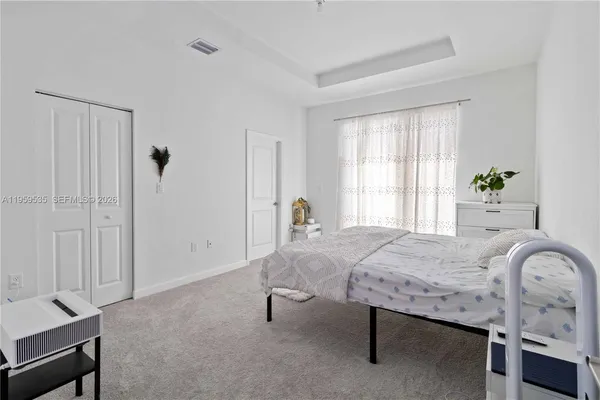 a bedroom with a bed and a table in it