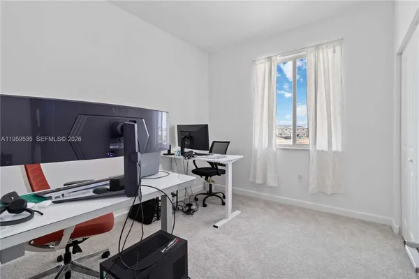 a workspace with furniture and a window