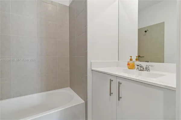 a bathroom with a sink and a bathtub