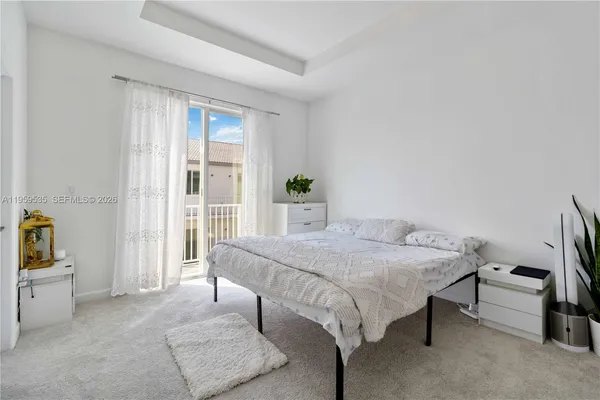 a bedroom with a bed and a table