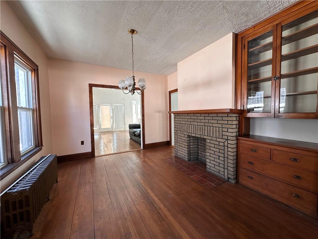 26 South Main Street Houston, PA 15342 - Photo 11 of 44 a view of hall with wooden floor and a fireplace