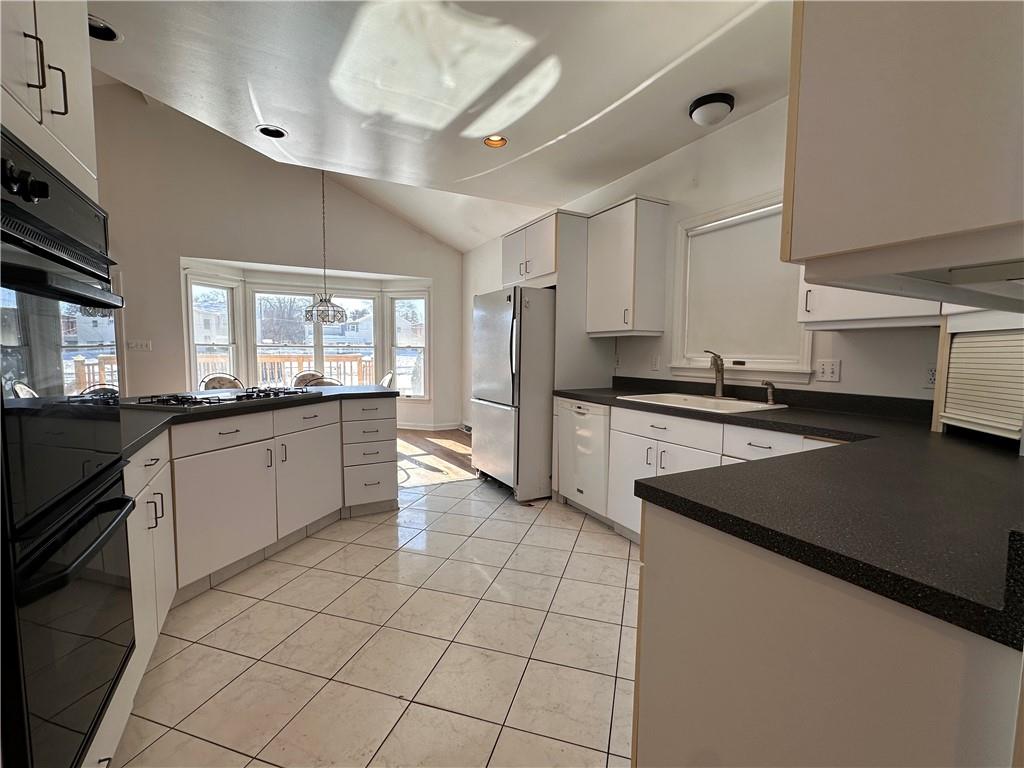 26 South Main Street Houston, PA 15342 - Photo 19 of 44 a kitchen with stainless steel appliances granite countertop a sink and a stove