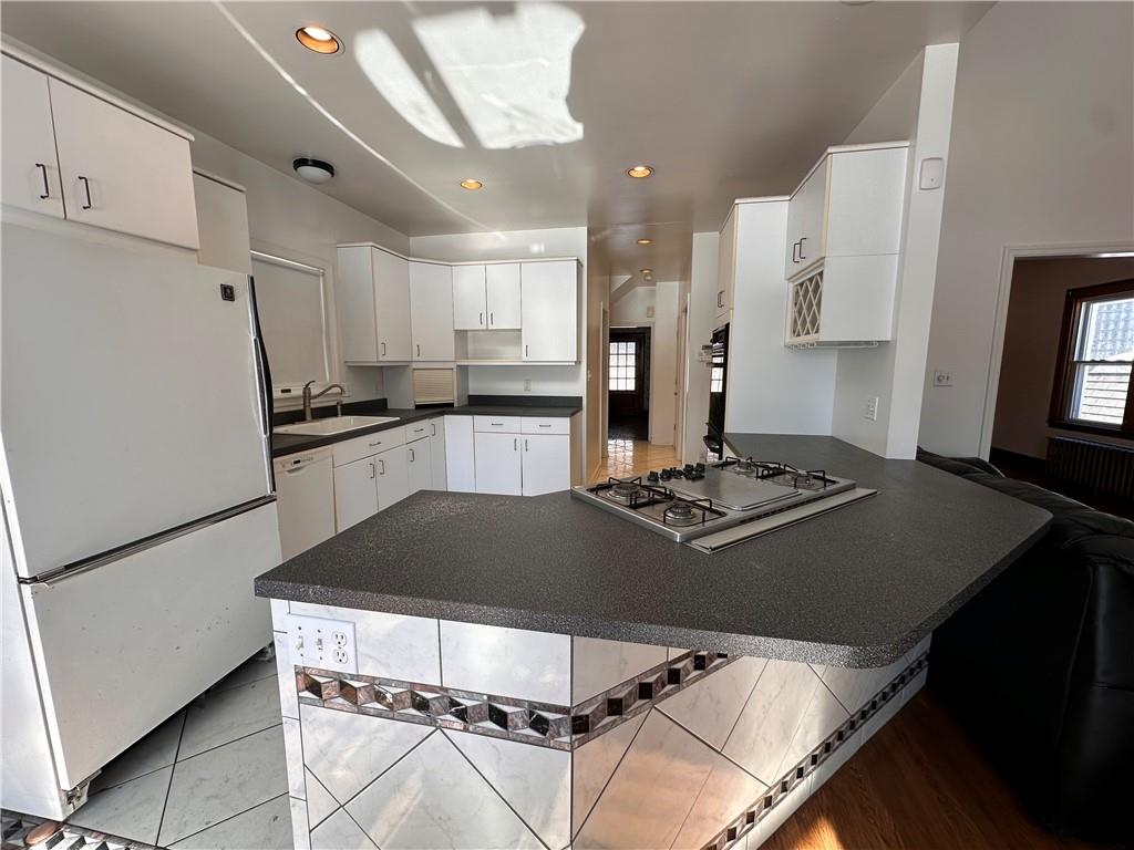 26 South Main Street Houston, PA 15342 - Photo 20 of 44 a kitchen with kitchen island a stove a refrigerator and a sink