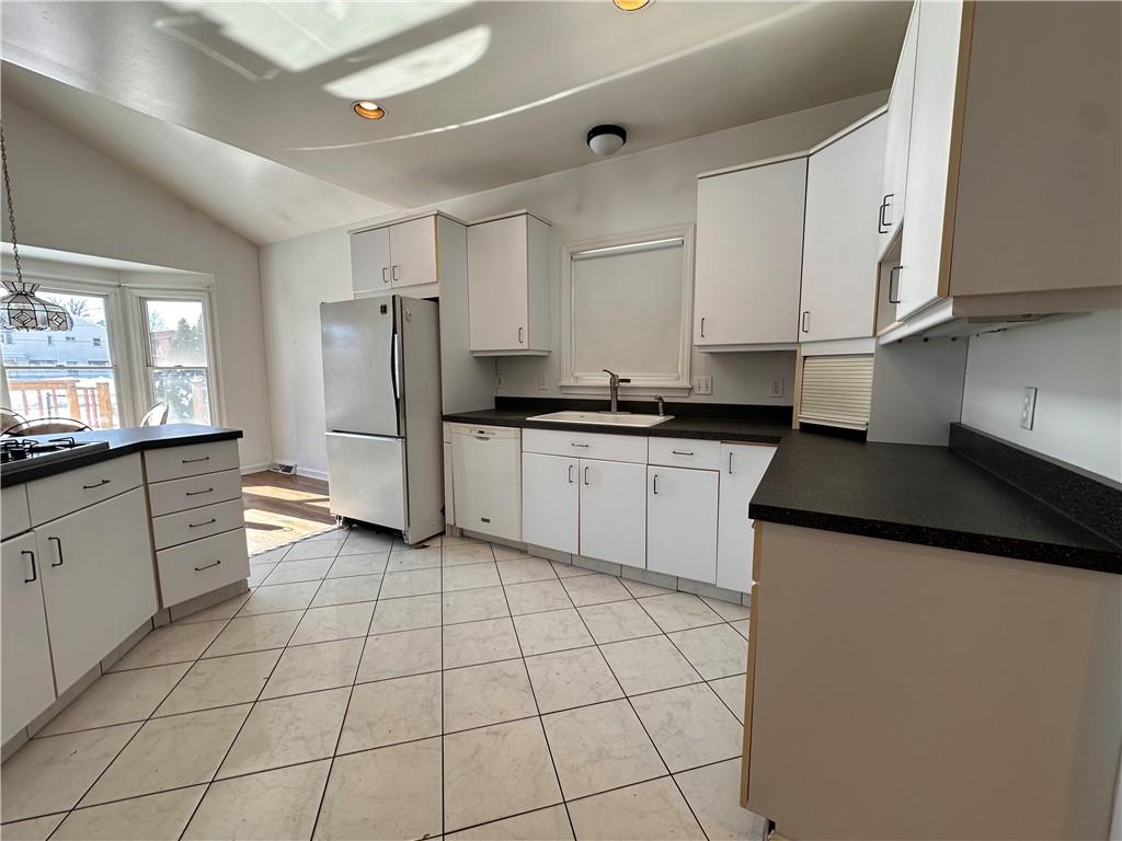 26 South Main Street Houston, PA 15342 - Photo 21 of 44 a kitchen with stainless steel appliances granite countertop a sink and a refrigerator