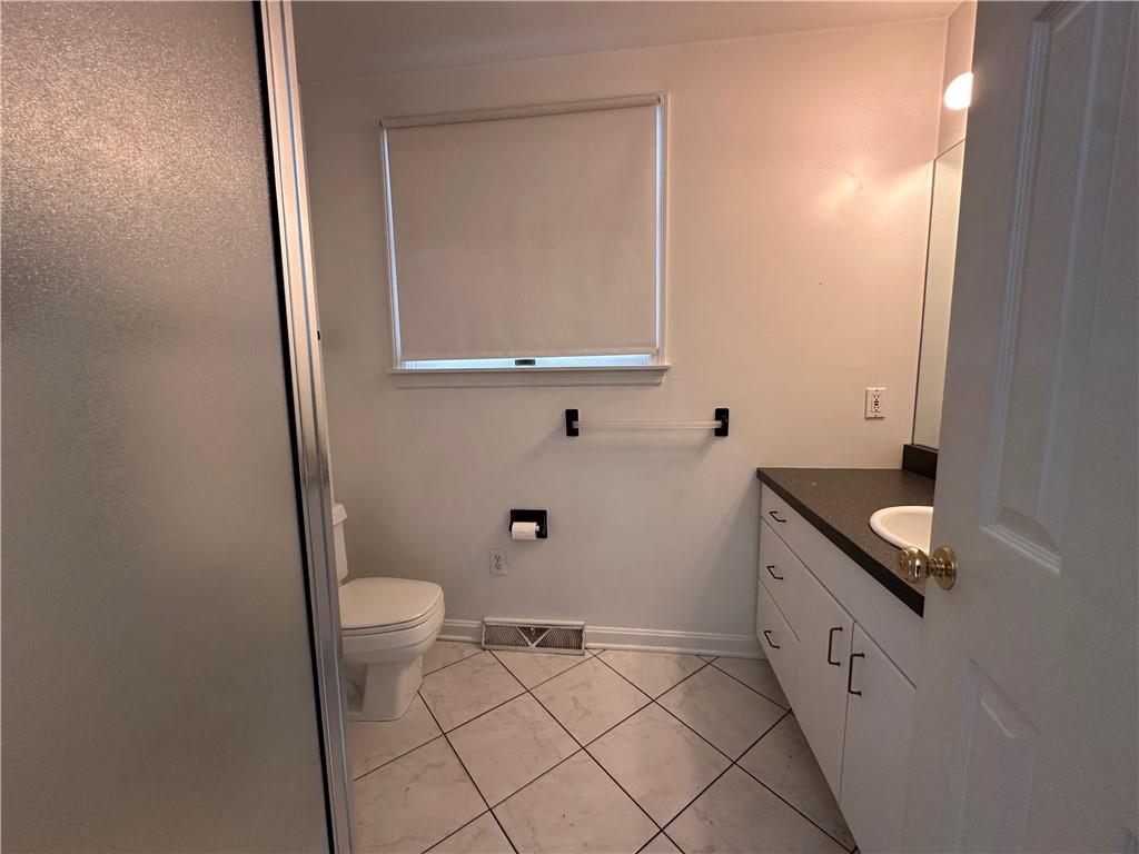 26 South Main Street Houston, PA 15342 - Photo 24 of 44 a bathroom with a granite countertop sink and a mirror