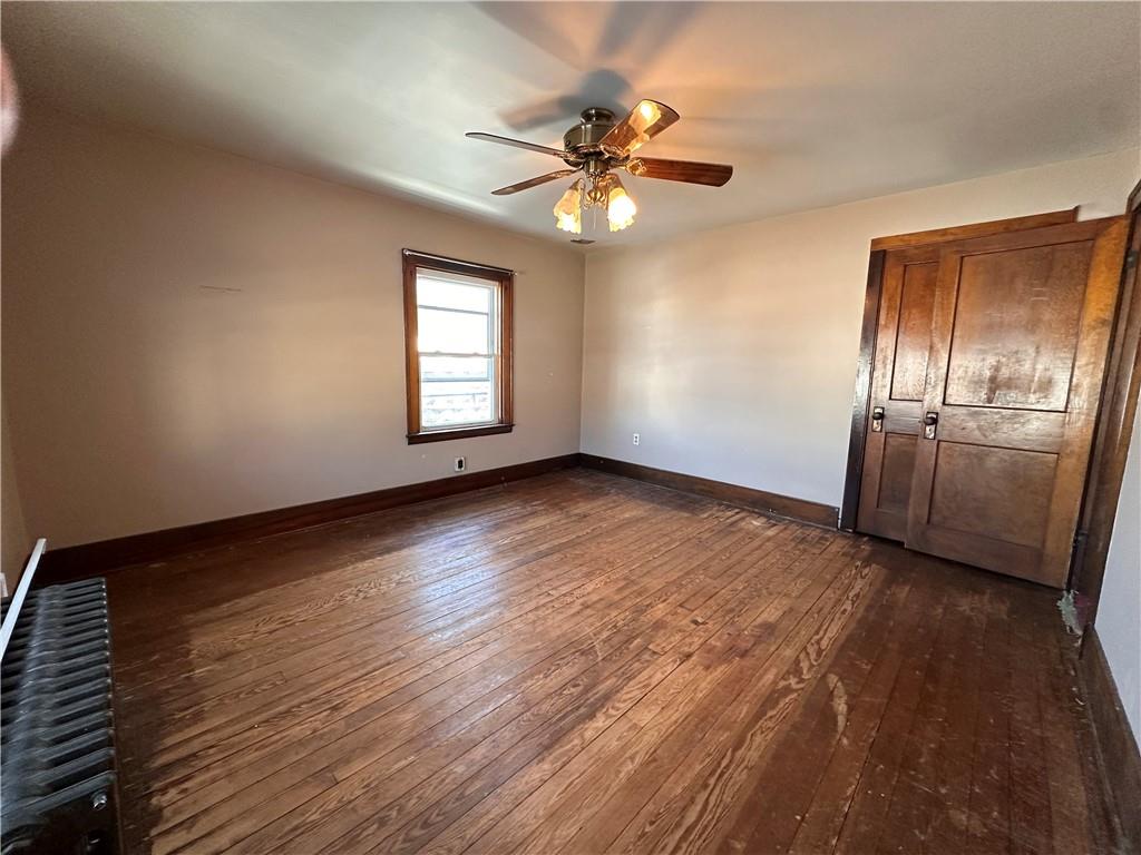 26 South Main Street Houston, PA 15342 - Photo 26 of 44 a view of an empty room with a window and wooden floor