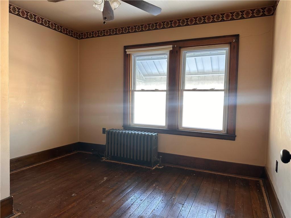 26 South Main Street Houston, PA 15342 - Photo 28 of 44 an empty room with wooden floor and windows