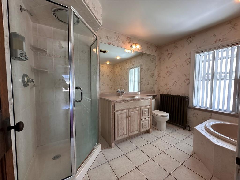 26 South Main Street Houston, PA 15342 - Photo 31 of 44 a spacious bathroom with a double vanity sink toilet mirror and shower
