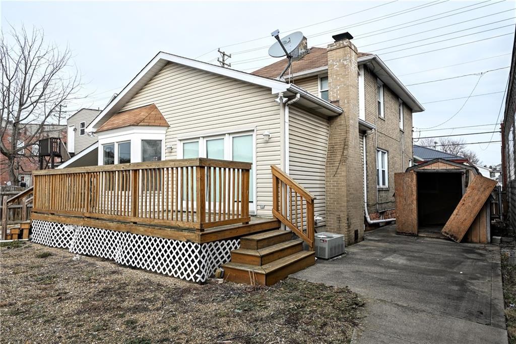 26 South Main Street Houston, PA 15342 - Photo 35 of 44 a view of a house with a deck and a yard