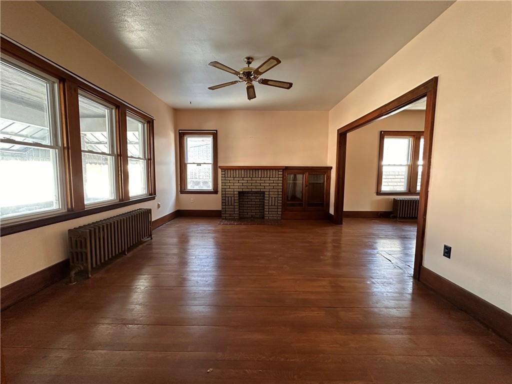 26 South Main Street Houston, PA 15342 - Photo 8 of 44 wooden floor in an empty room with a window