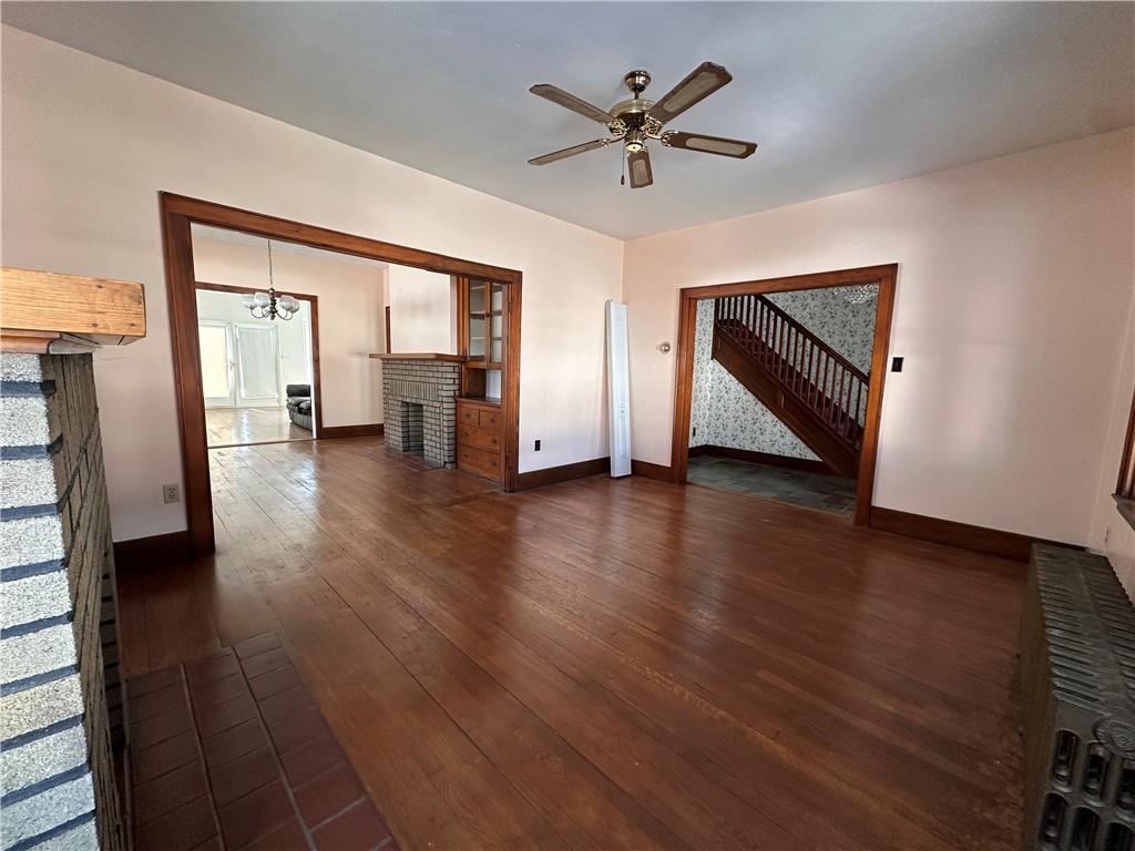 26 South Main Street Houston, PA 15342 - Photo 10 of 44 a view of an empty room with a window and wooden floor