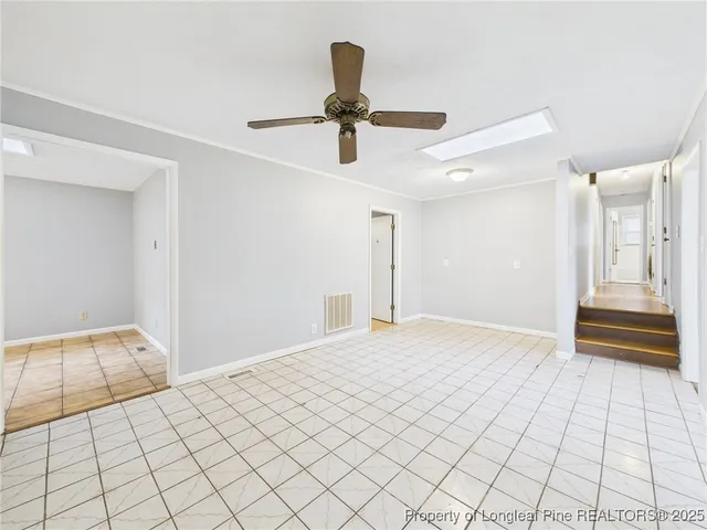 a view of an empty room and window