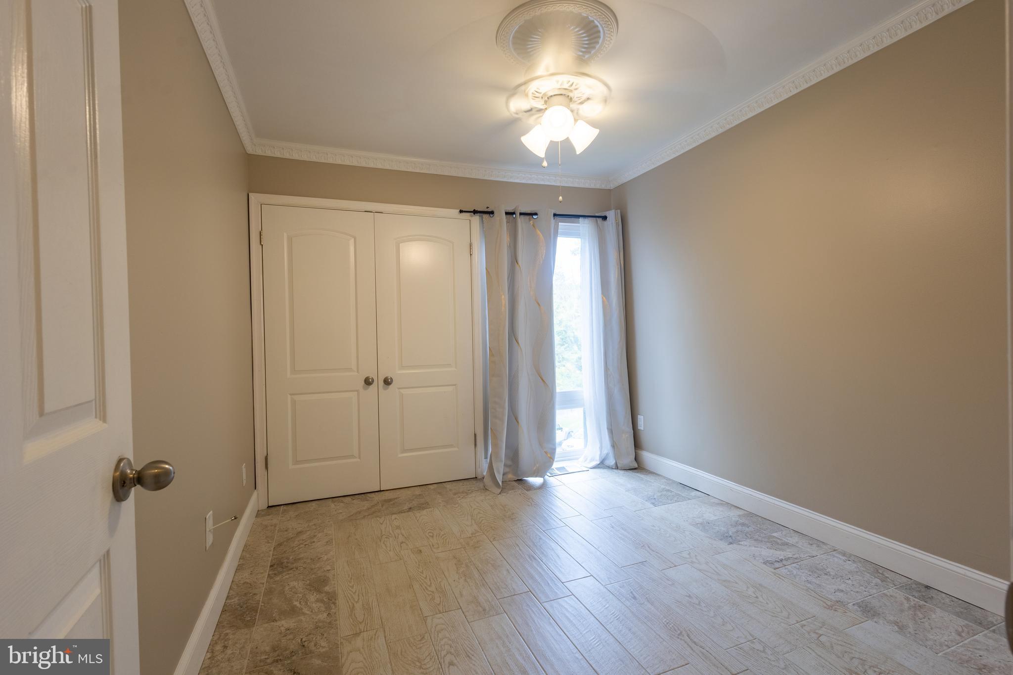 3332 Claridge Court Silver Spring, MD 20902 - Photo 15 of 30 wooden floor in an empty room with a window