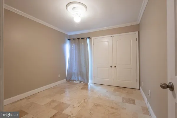 an empty room with closet area