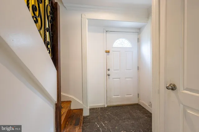 a view of a hallway with front door