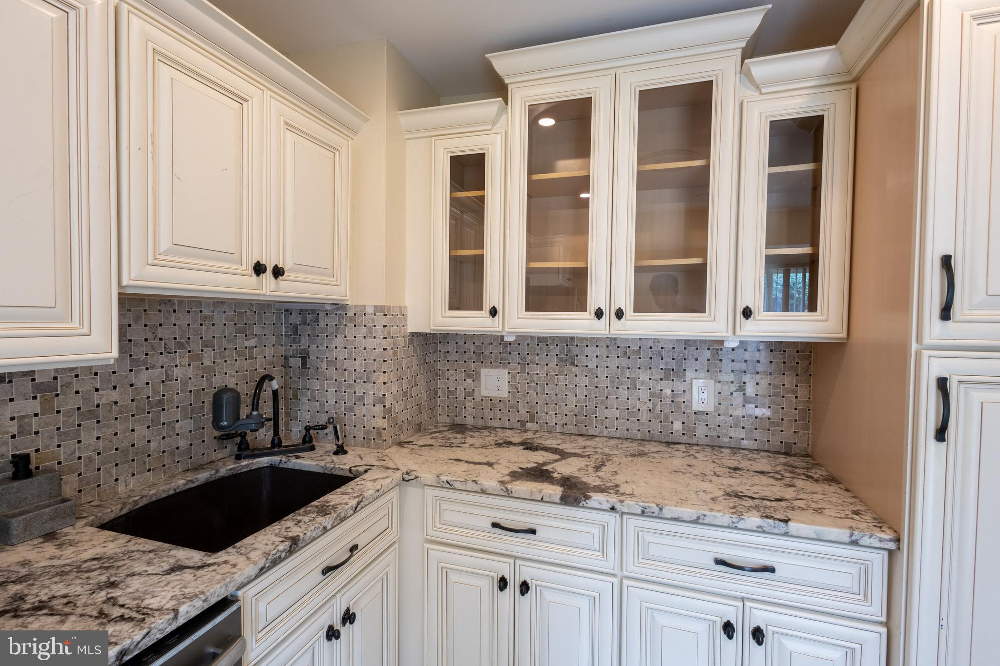 3332 Claridge Court Silver Spring, MD 20902 - Photo 23 of 30 a kitchen with granite countertop a sink and cabinets