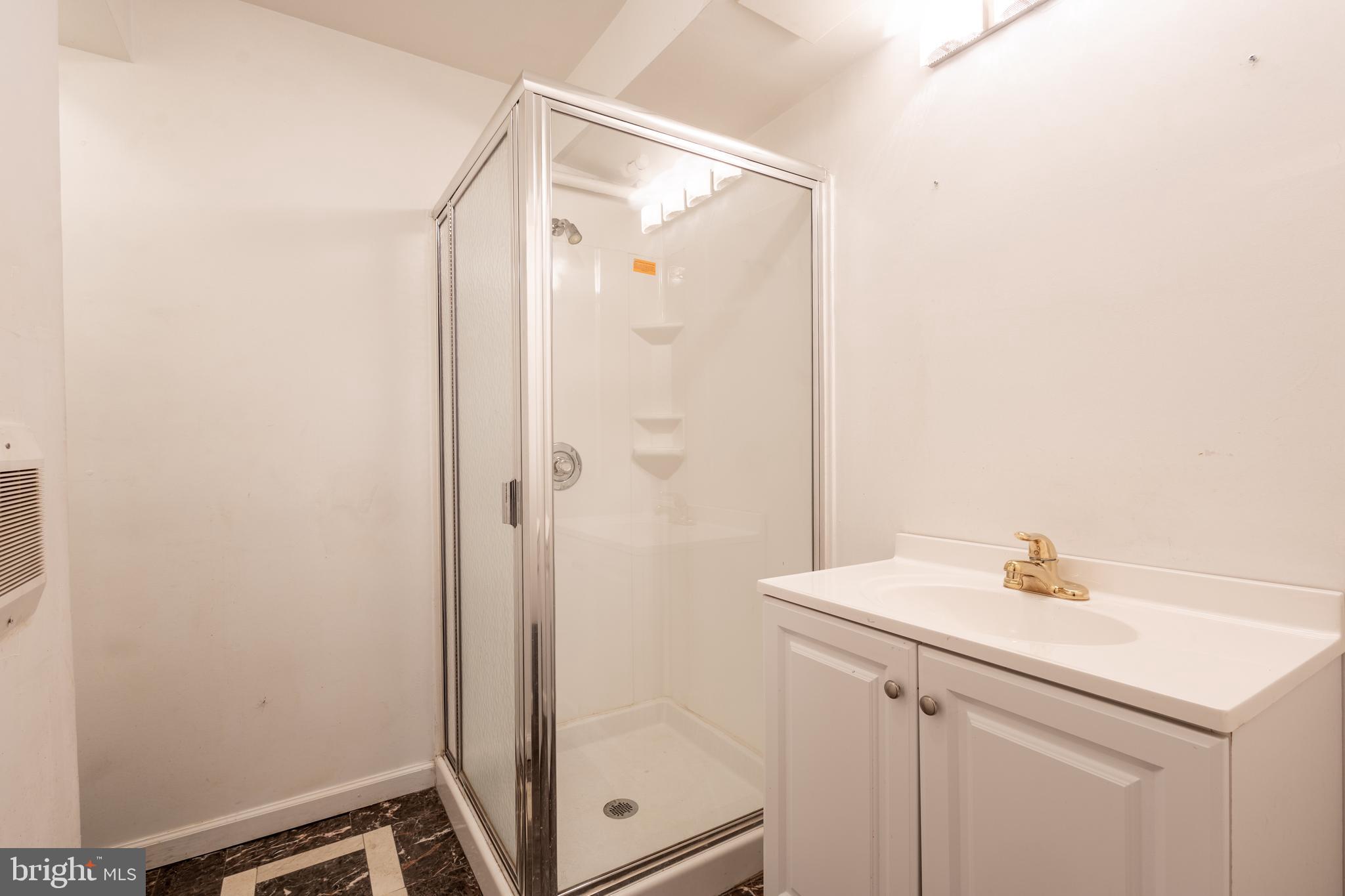 3332 Claridge Court Silver Spring, MD 20902 - Photo 25 of 30 a bathroom with a shower and sink