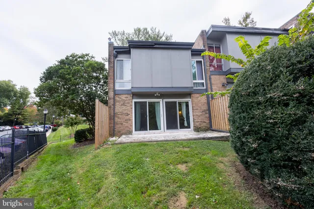 a view of a house with a garden and plants