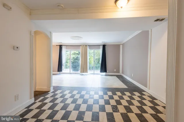 a view of an empty room and window