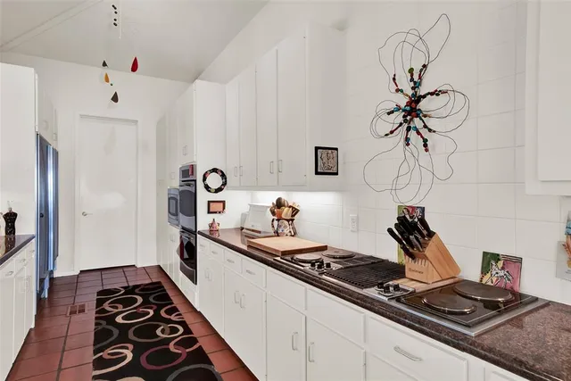 a kitchen with a sink and a stove
