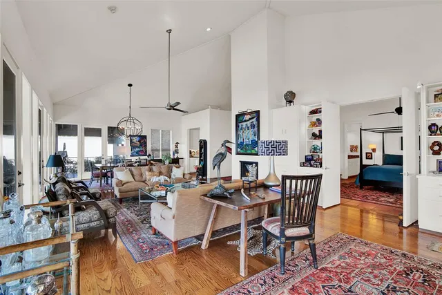 a very nice looking living room with dining room and wooden floor