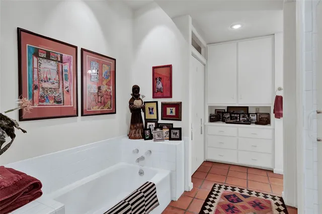 a bathroom with a bathtub and a shower