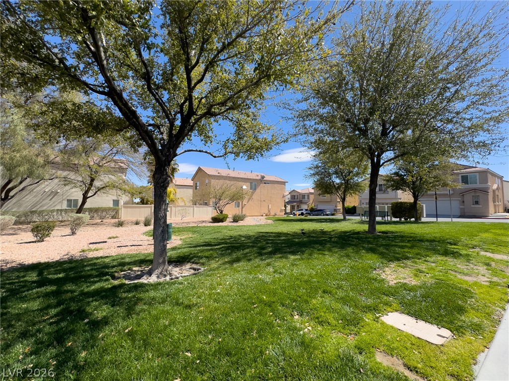 9456 Grandview Spring Avenue Las Vegas, NV 89166 - Photo 48 of 49 Green spaces and established trees frame this peaceful neighborhood setting.