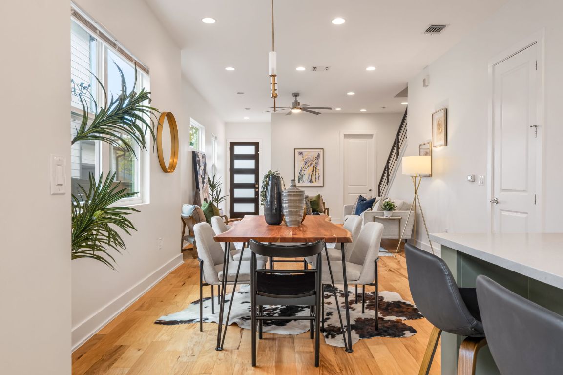 1301 Cometa Street, Unit A Austin, TX 78721 - Photo 11 of 38 Dining space with modern lighting, and natural light streaming through multiple windows