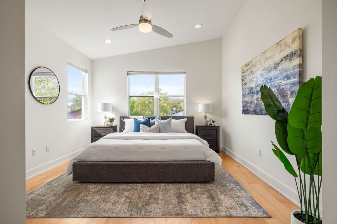 1301 Cometa Street, Unit A Austin, TX 78721 - Photo 17 of 38 Private primary suite with two large closets and an ensuite bath featuring