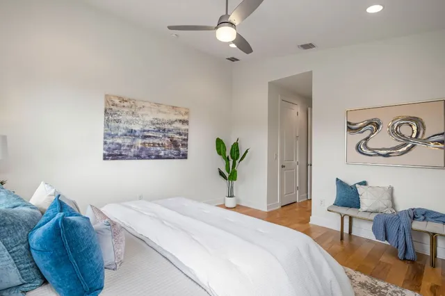 a bedroom with bed and a couch