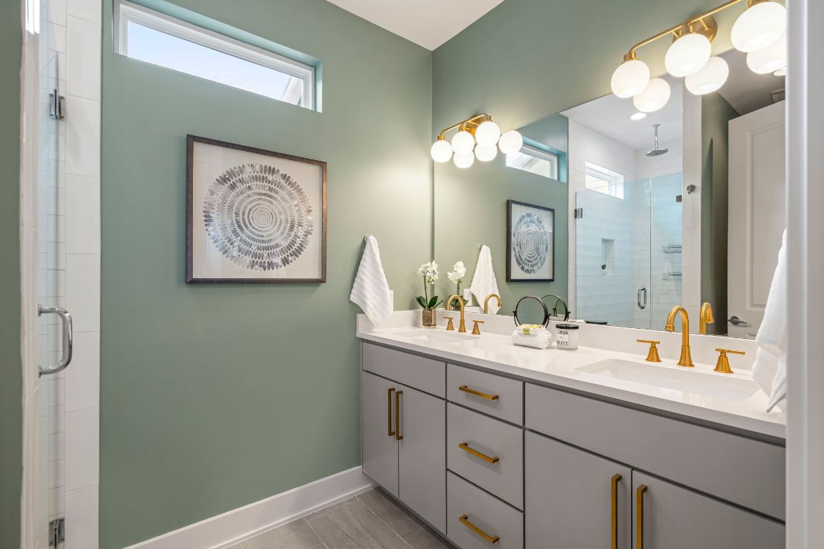 1301 Cometa Street, Unit A Austin, TX 78721 - Photo 20 of 38 En suite featuring a dual vanity and sleek walk-in shower