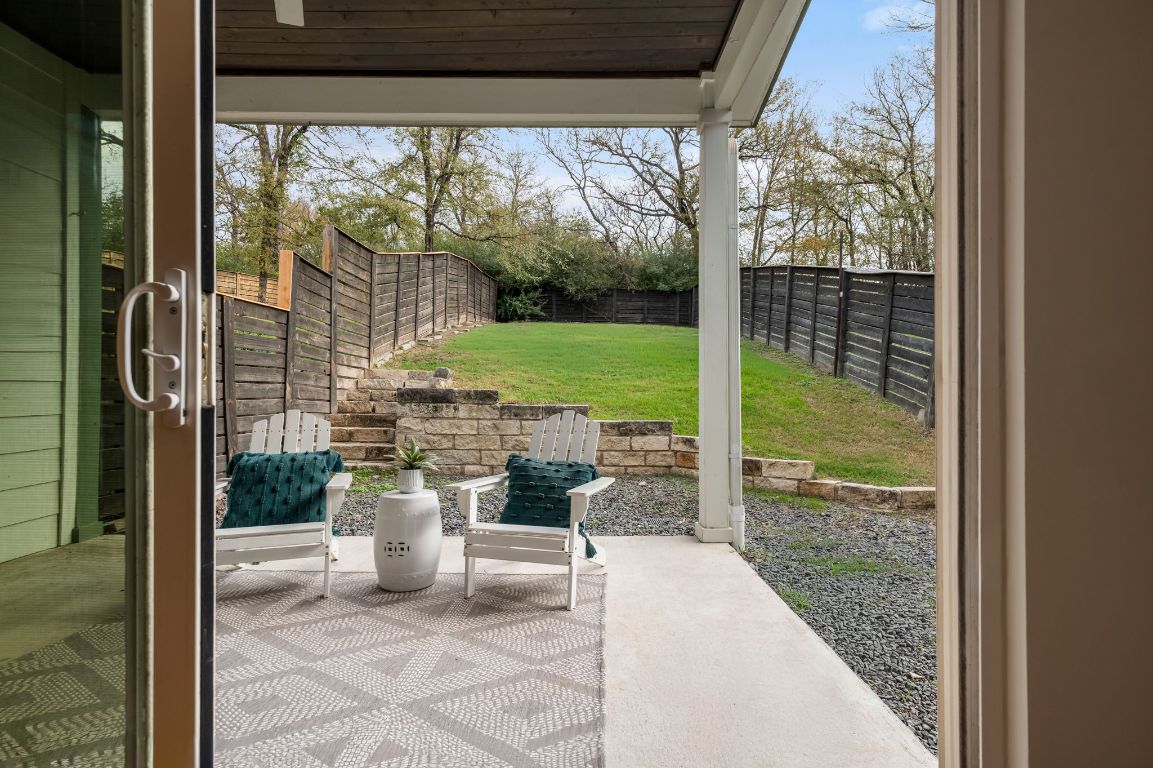 1301 Cometa Street, Unit A Austin, TX 78721 - Photo 27 of 38 Step outside to a covered back patio with a ceiling fan overlooking a low-maintenance yard ideal for relaxing, pets, or outdoor dining