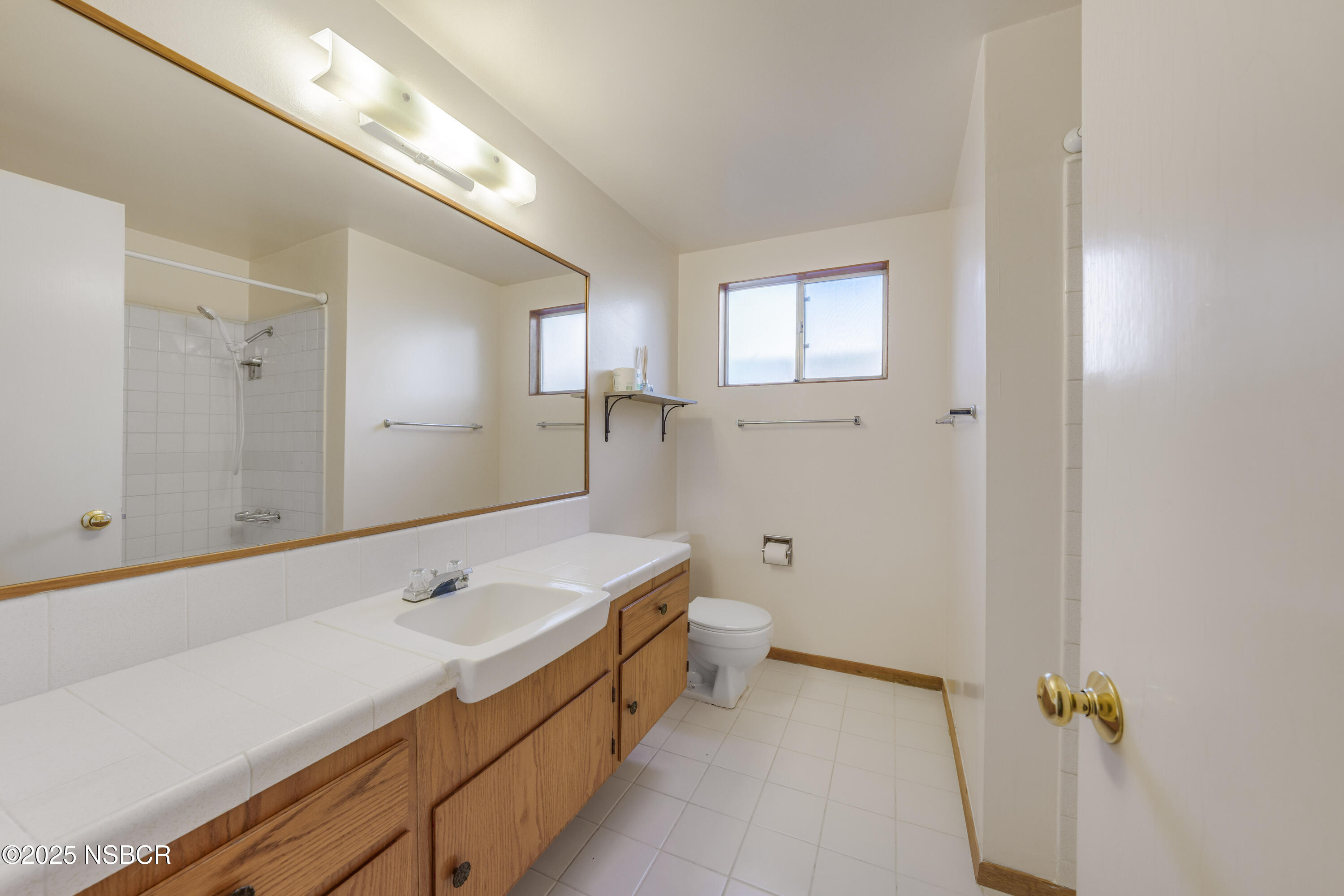 252 Pegasus Avenue Lompoc, CA 93436 - Photo 20 of 33 a bathroom with a sink a toilet and shower