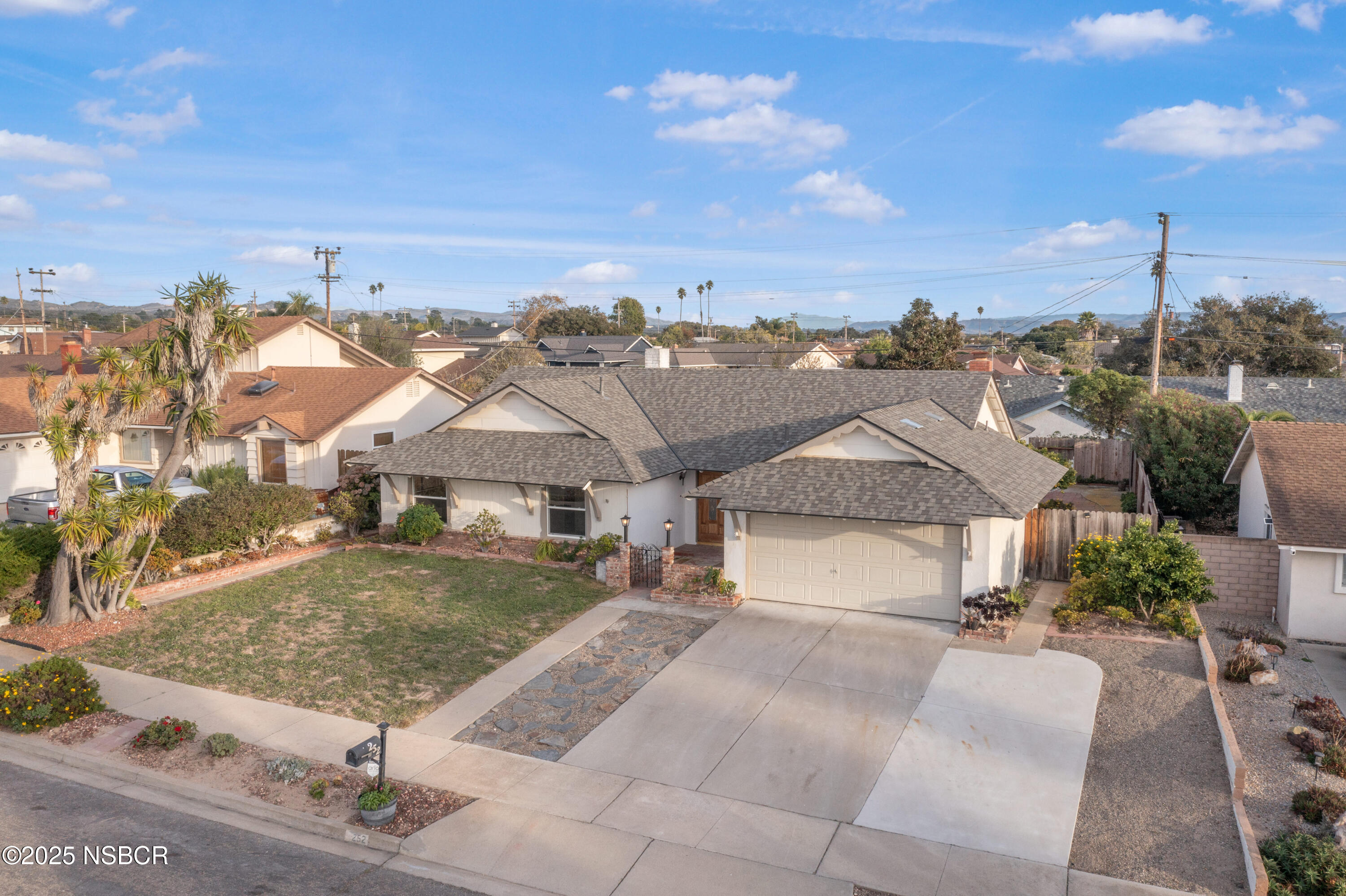 252 Pegasus Avenue Lompoc, CA 93436 - Photo 2 of 33 a view of a house with a yard