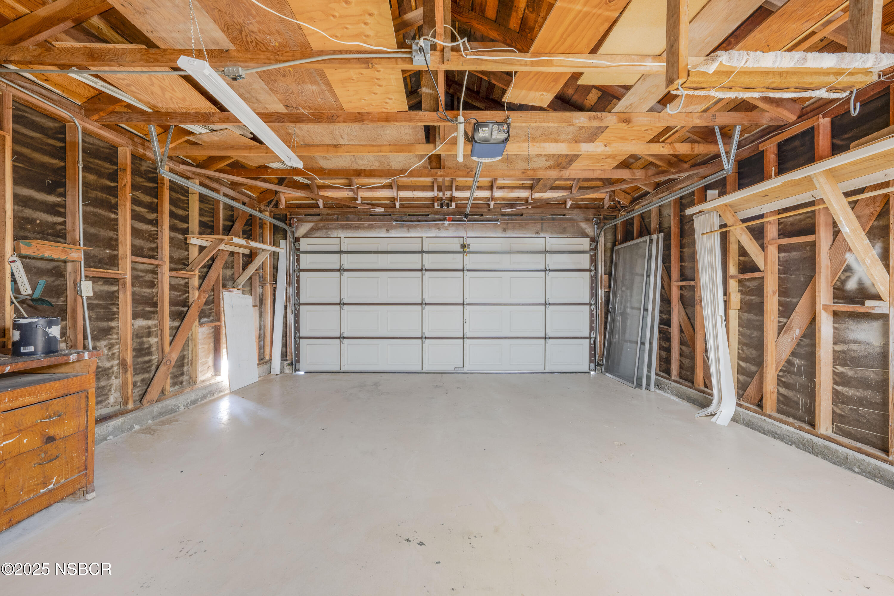 252 Pegasus Avenue Lompoc, CA 93436 - Photo 31 of 33 a view of a garage with wooden floors