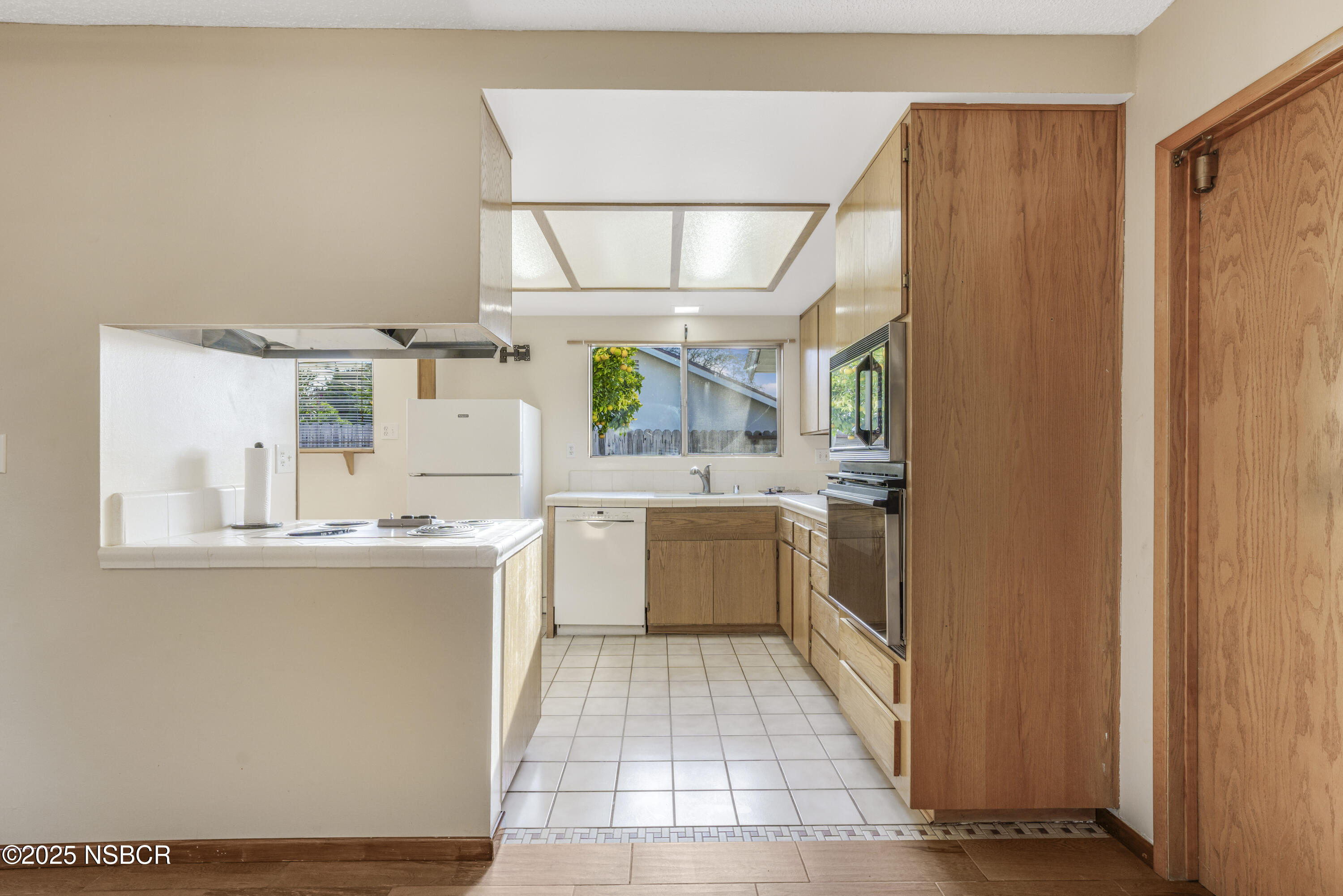 252 Pegasus Avenue Lompoc, CA 93436 - Photo 10 of 33 a large kitchen with a lot of counter space and a window