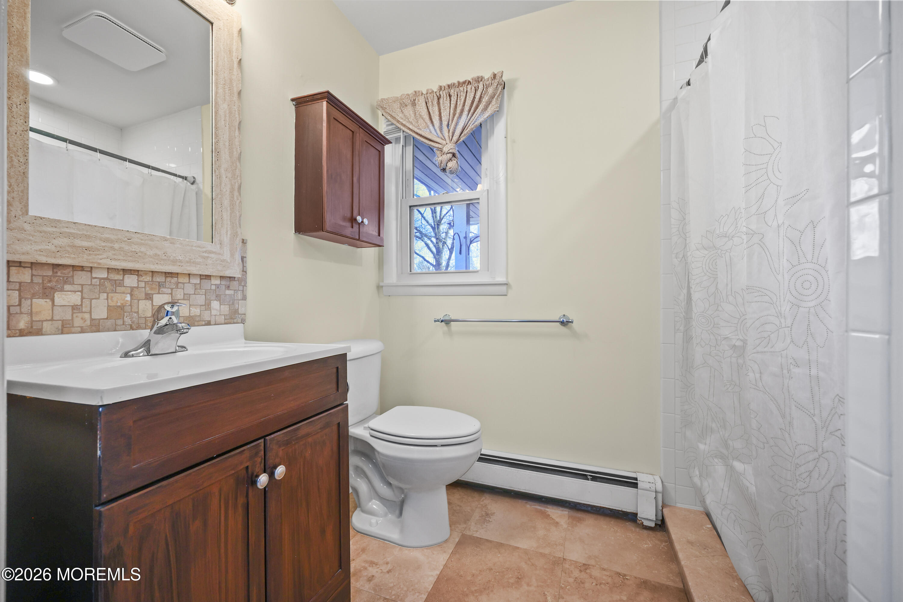 573 Lloyd Road Aberdeen, NJ 07747 - Photo 11 of 23 a bathroom with a sink toilet and mirror
