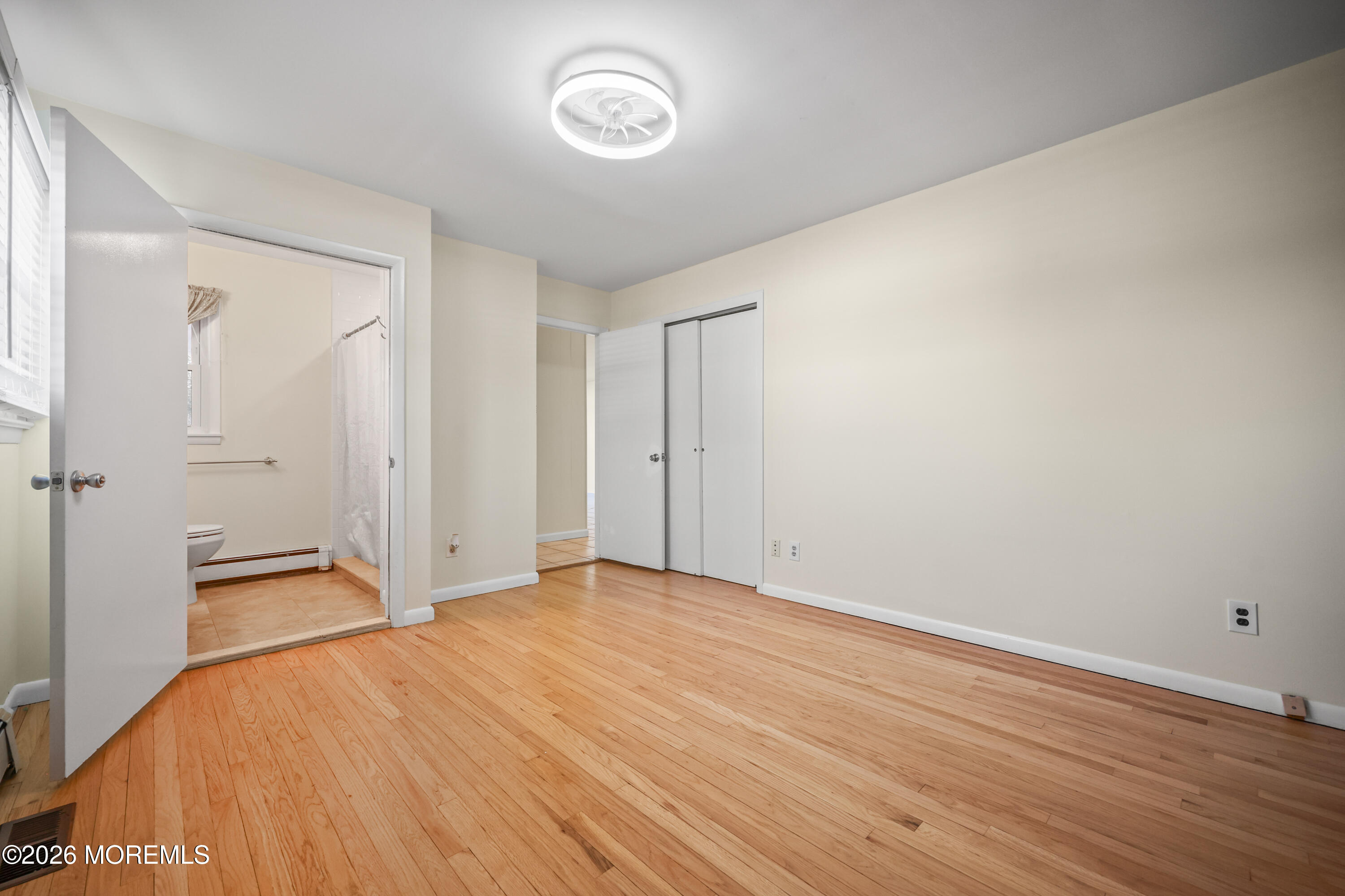 573 Lloyd Road Aberdeen, NJ 07747 - Photo 12 of 23 a view of empty room with wooden floor