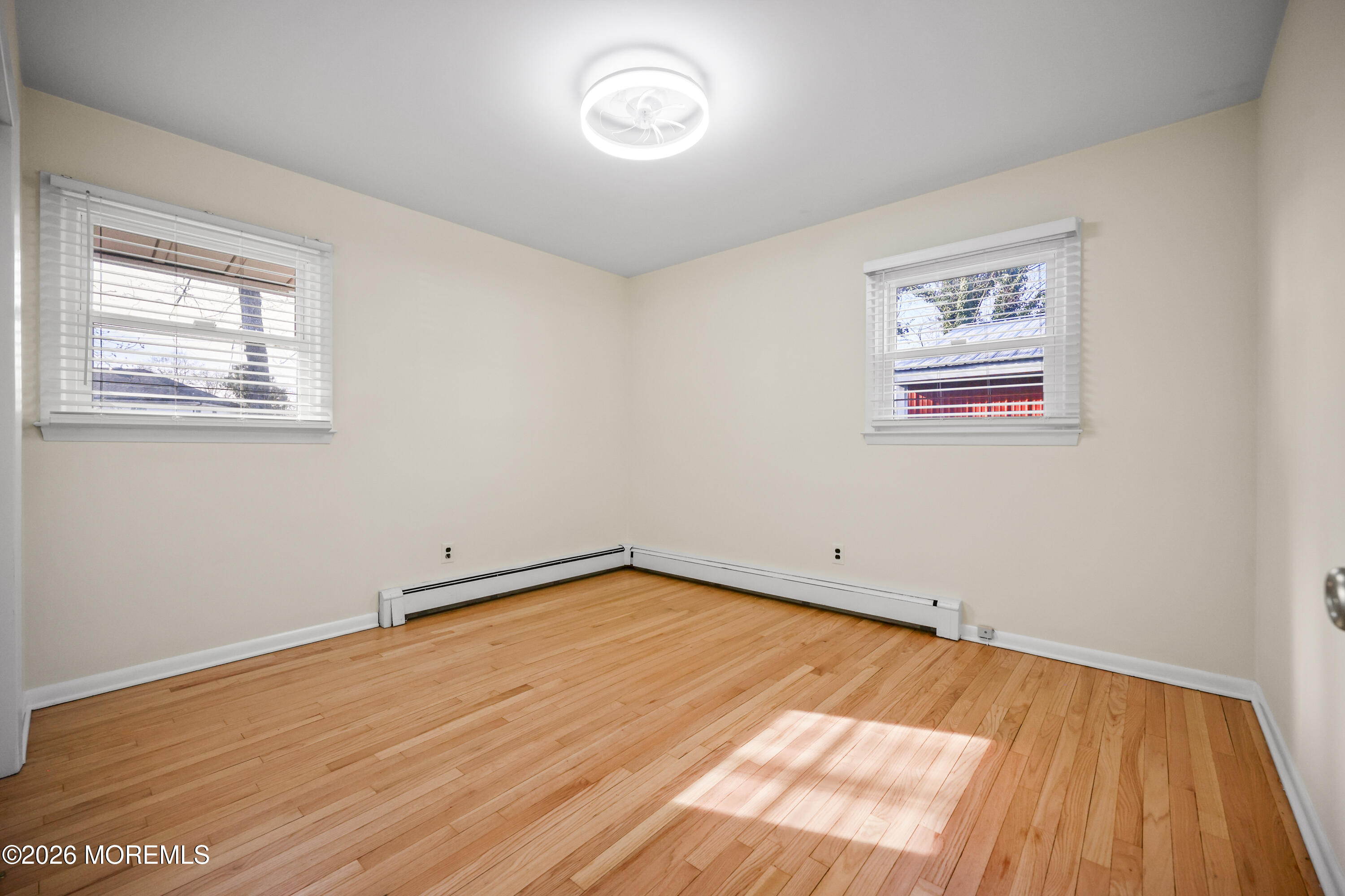 573 Lloyd Road Aberdeen, NJ 07747 - Photo 13 of 23 a view of a room with wooden floor and a window