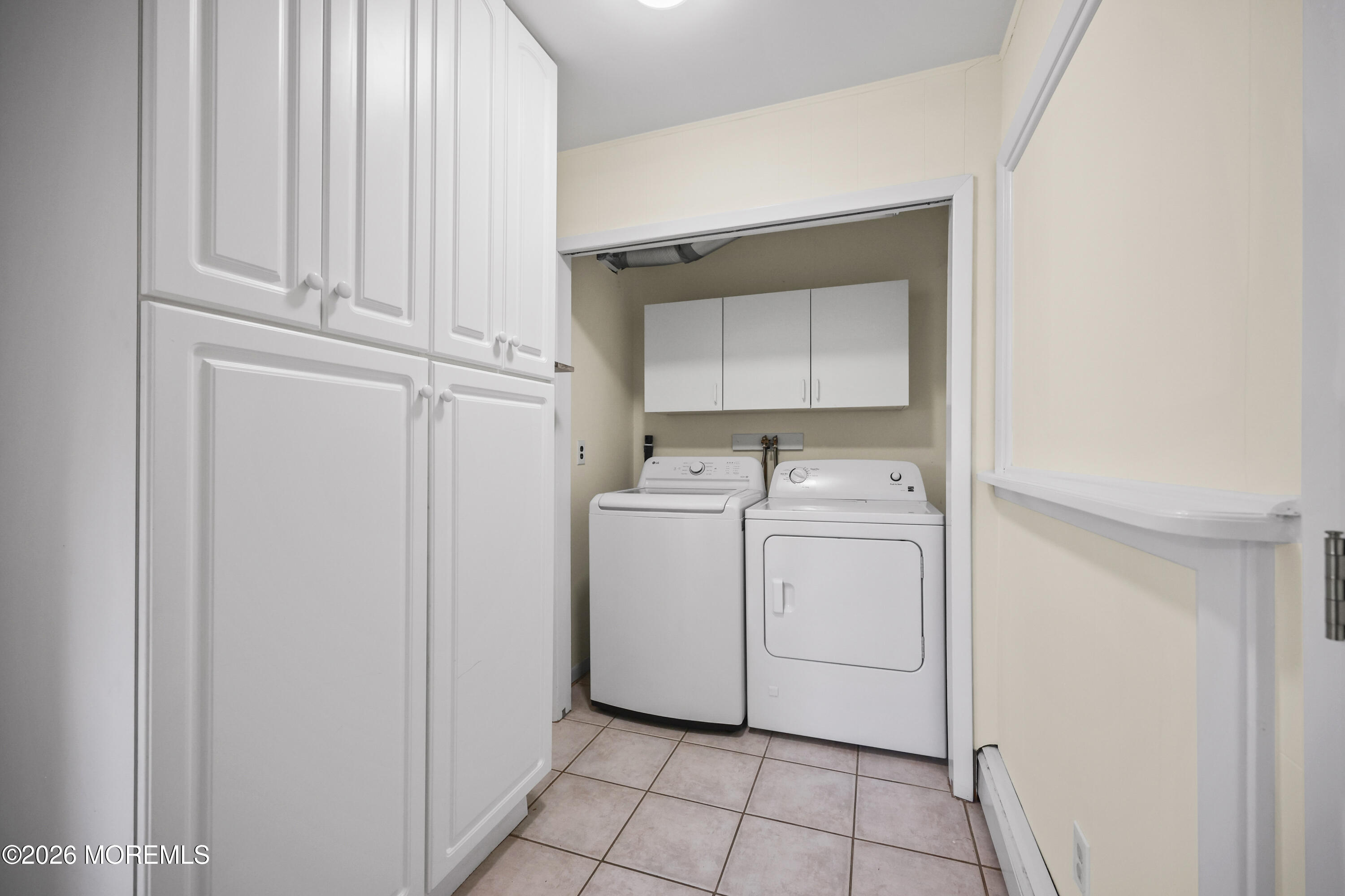 573 Lloyd Road Aberdeen, NJ 07747 - Photo 15 of 23 a utility room with dryer and washer