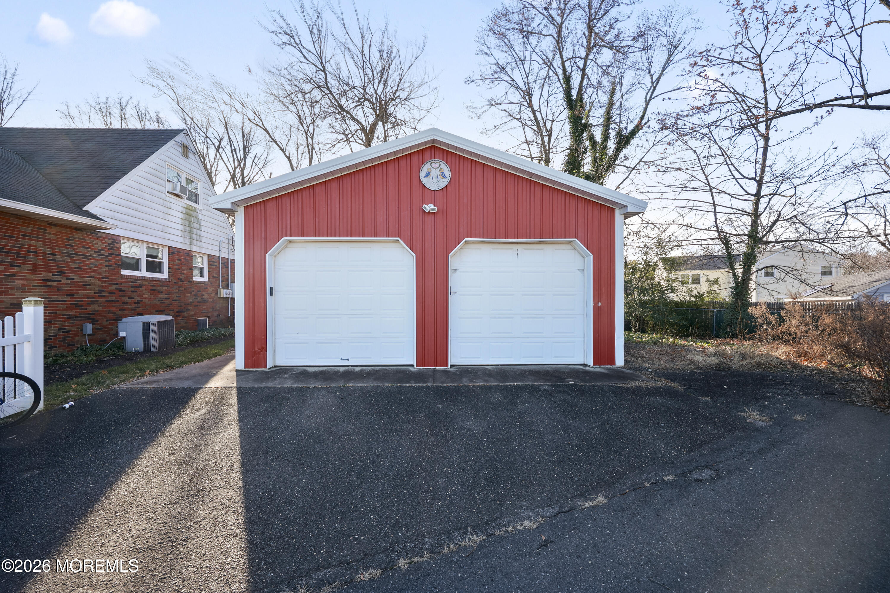 573 Lloyd Road Aberdeen, NJ 07747 - Photo 20 of 23 a front view of a house with a yard and garage