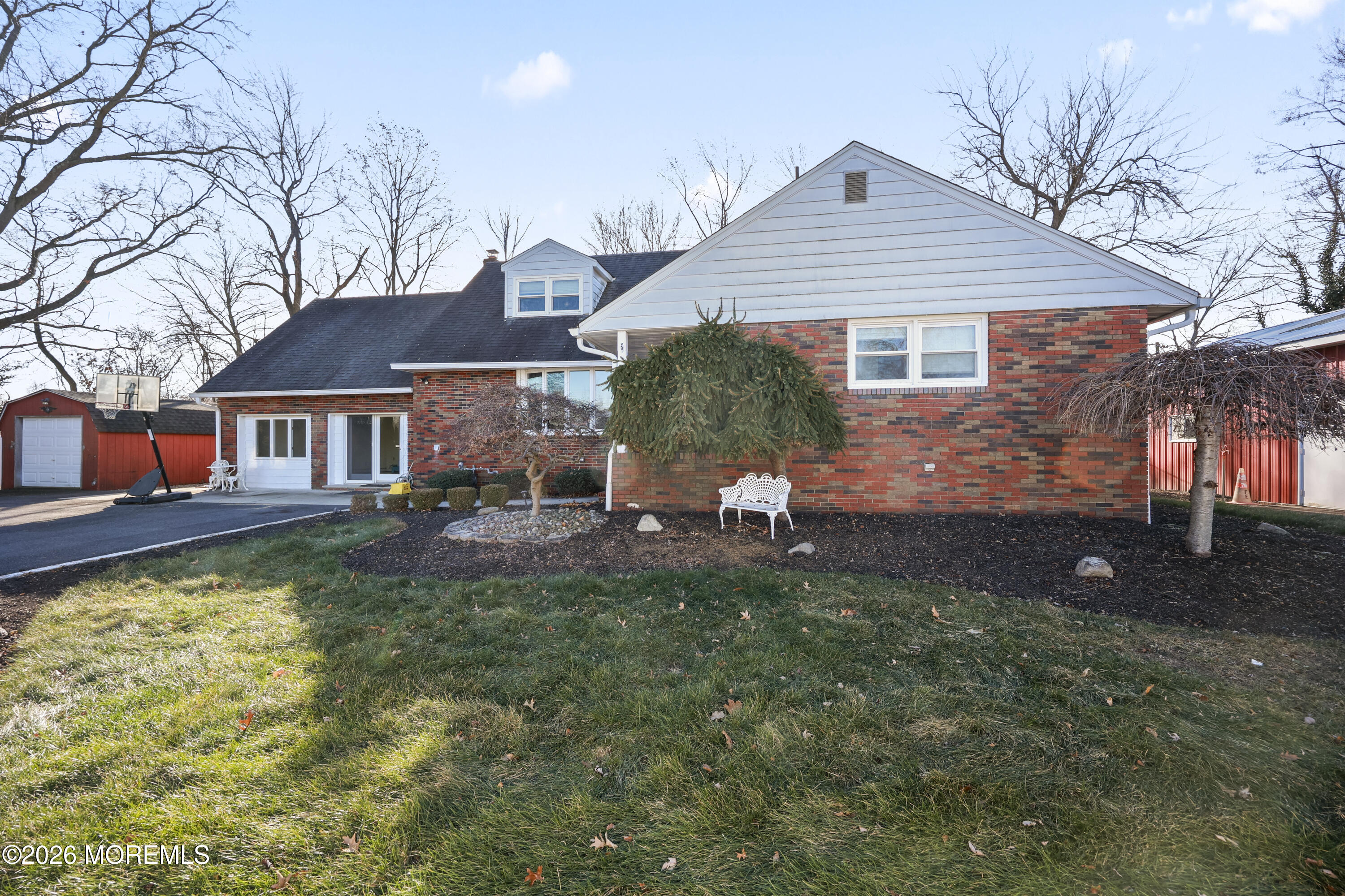 573 Lloyd Road Aberdeen, NJ 07747 - Photo 22 of 23 a front view of a house with garden
